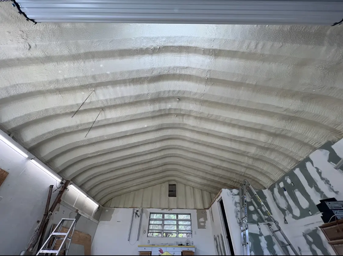 Spray polyurethane foam applied to the underside of a metal roof deck in Canton